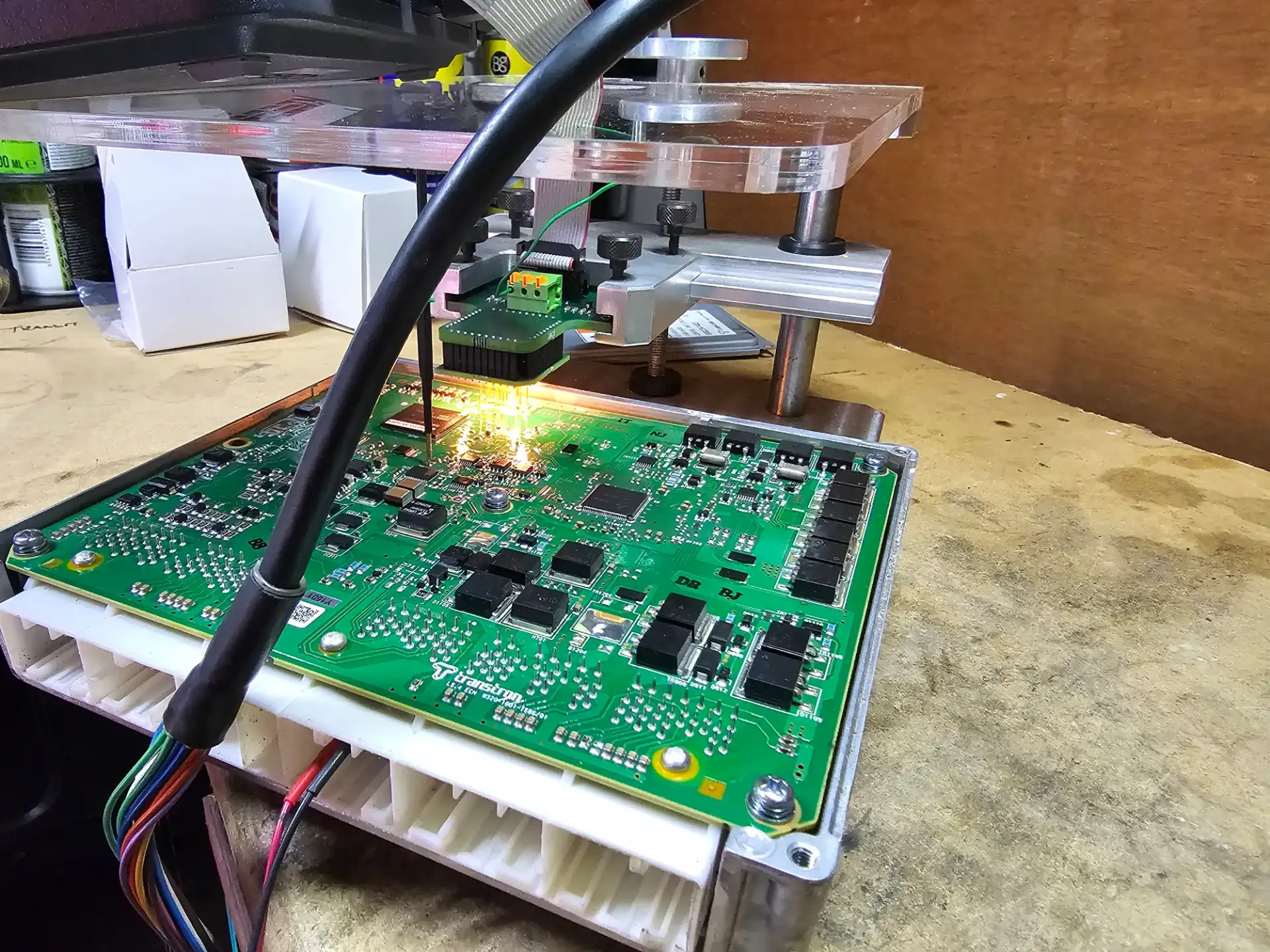 The ECU opened on the bench rig with probes attached