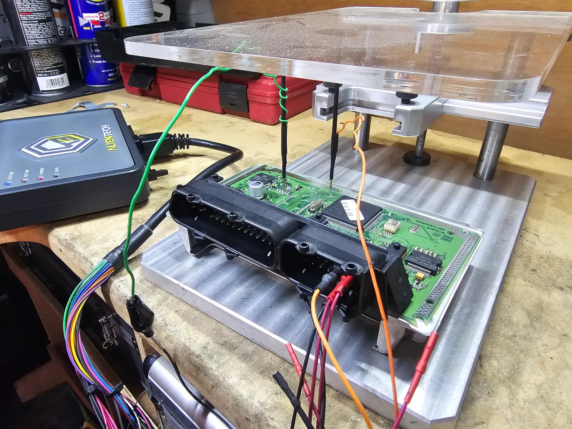 ECU on the bench rig with probes attached for a bench read
