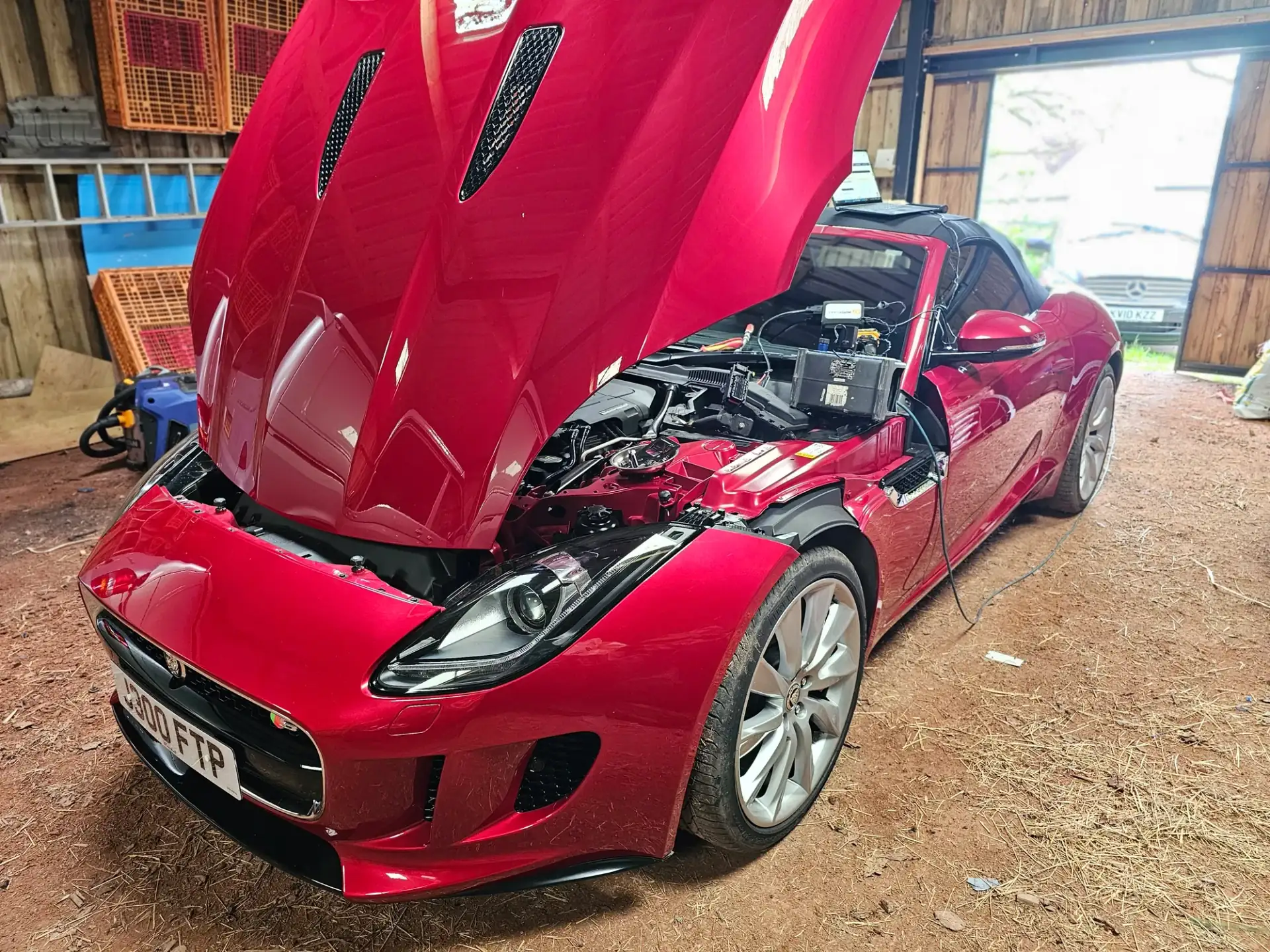 The day job — laptop on the engine bay, reading an ECU at a customer's home